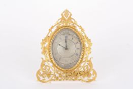 A Victorian gilt metal easel clock by London & Ryderthe engraved oval silvered dial with blued