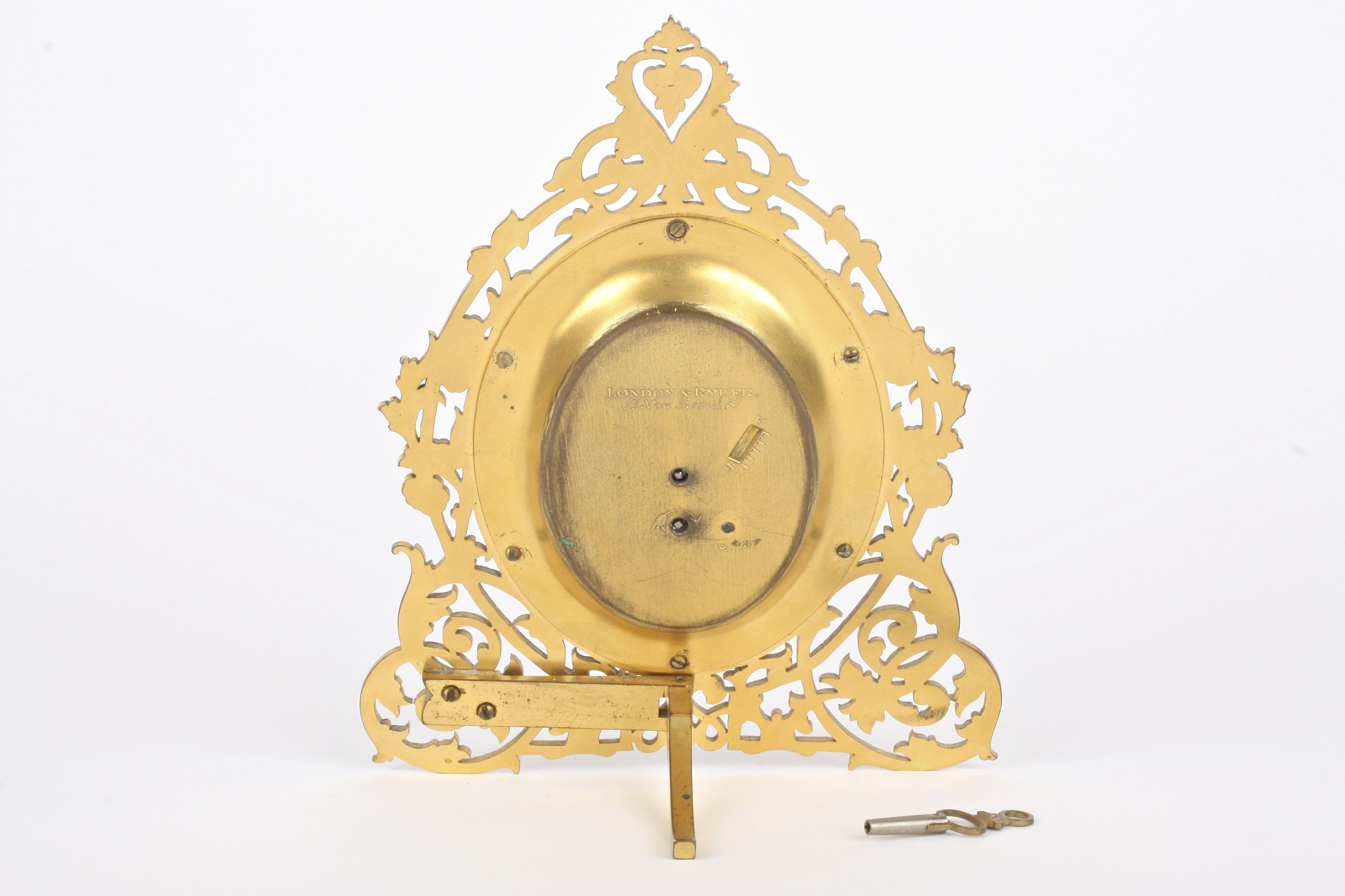 A Victorian gilt metal easel clock by London & Ryder
the engraved oval silvered dial with blued - Image 3 of 4