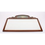 An Edwardian Sheraton Revival mahogany wall mirror
crested with a domed top painted panel