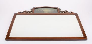 An Edwardian Sheraton Revival mahogany wall mirrorcrested with a domed top painted panel