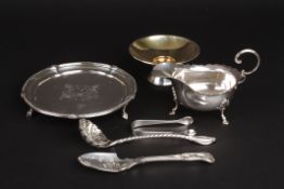A small collection of silver itemsincluding a modern Birmingham silver card waiter, a silver