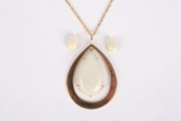 A large 9ct gold mounted opal pendant on chainthe opal of pear shaped form, in an oval mount,