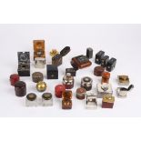 A large collection of mostly Victorian travelling inkwells
including a silver and glass square