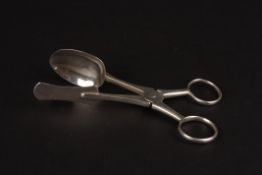 A pair of George IV silver egg tongshallmarked London 1829, of plain form with looped handles,