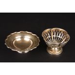 Two small silver bonbon dishes
one of petal form hallmarked Birmingham 1946 by Adie brothers, the