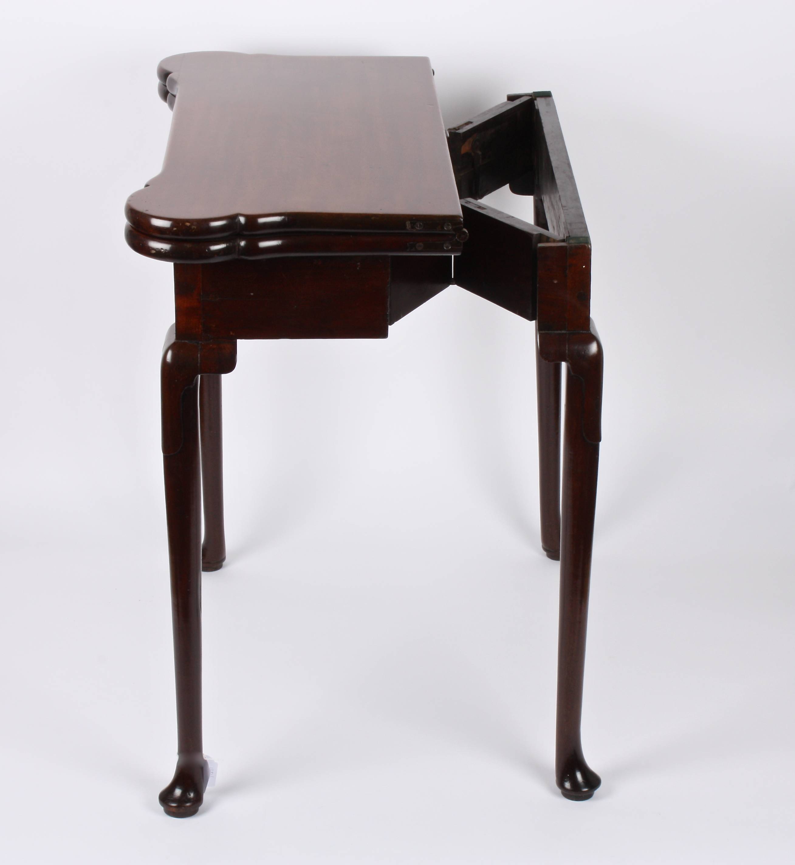 A George II mahogany foldover card table
the shaped top opening to reveal circular carved trays - Image 3 of 3