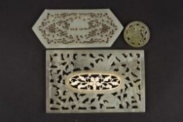 A Chinese 20th century pale jade carved rectangular panelwith central pierced floral inset, another