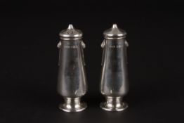An Edwardian Art Nouveau silver salt and pepperettehallmarked Sheffield 1908,  of tapered form with
