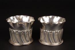 A pair of Victorian silver shaped small vaseshallmarked London 1892, with frilled necks and semi-
