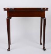 A George II mahogany foldover card tablethe shaped top opening to reveal circular carved trays