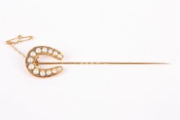 A large Victorian half pearl and rose point diamond horseshoe pin  with safety chain , length
