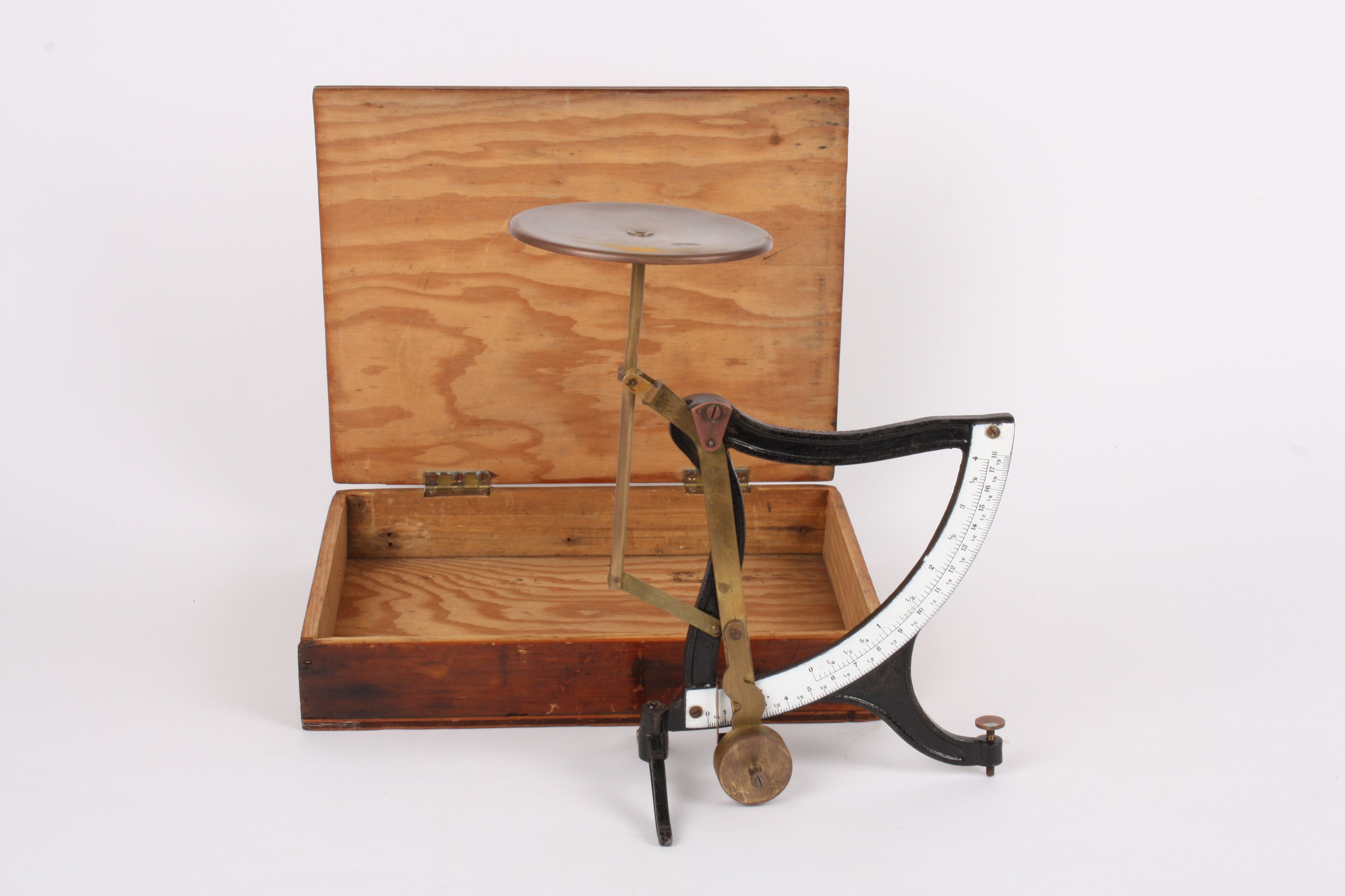 A set of collapsible brass and wrought iron early 20th century parcel scales
with circular brass