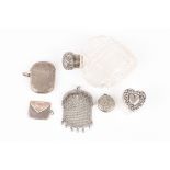 A Victorian silver topped cut glass heart shaped perfume bottle and a collection of small silver