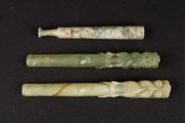 Two 20th century Chinese carved hardstone cigarette holders in the form of open mouthed dragons and