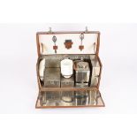 A vintage travelling picnic set for two
the rectangular fitted leather case opening up to reveal two