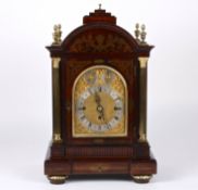 A large late 19th century rosewood musical mantel clockthe gilded arched dial with silvered chapter