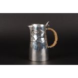 A Liberty Tudric silver plated cafe au lait pot, designed by Archibald Knox
with moulded foliate