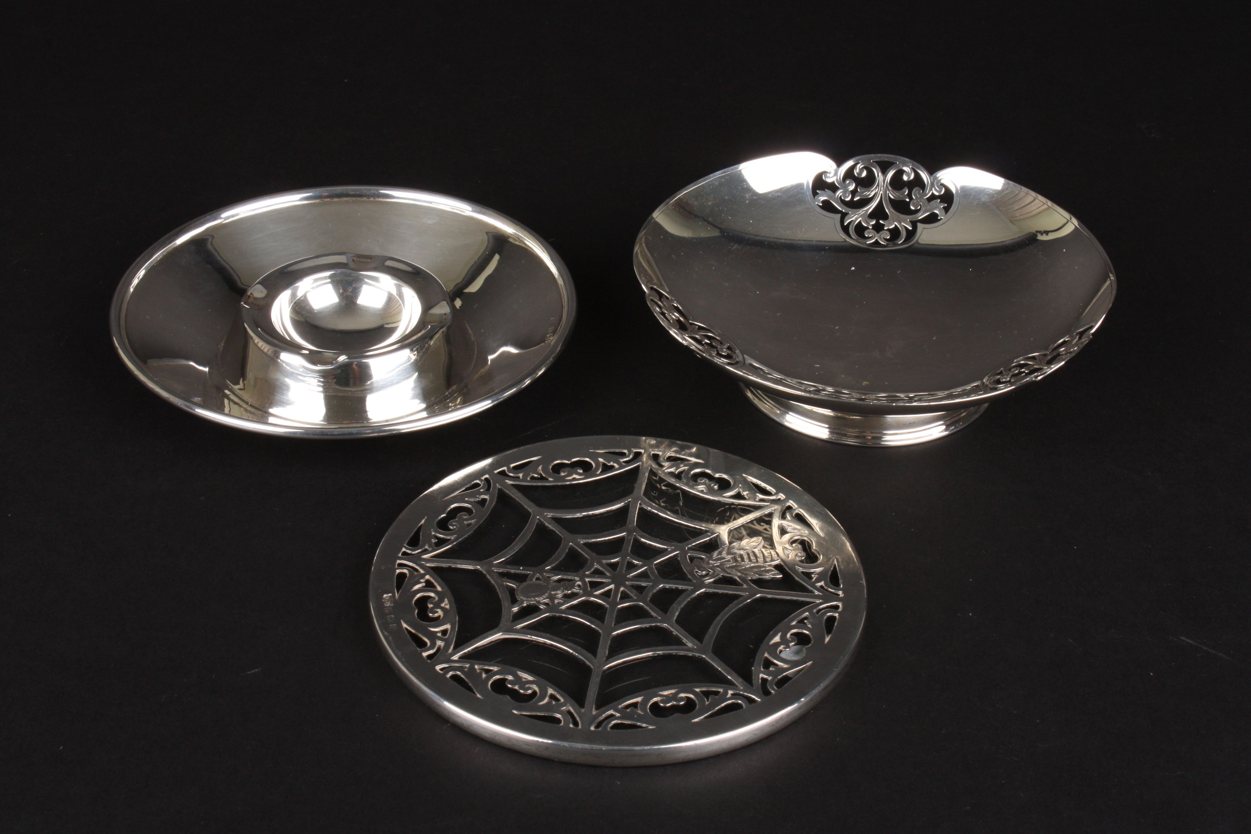 A George V silver bonbon dish
hallmarked Birmingham 1936, together with a silver ashtray and a