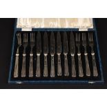 A Victorian Art Deco silver handled dessert knife and fork set
hallmarked Sheffield 1936, in a