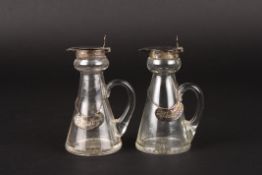 A pair of George V silver topped glass whisky flaskshallmarked Birmingham 1912, with decanter