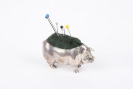 A silver pin cushion in the form of a pigthe novelty cushion realistically modelled and