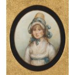 A miniature oval portrait of a young girl
initialled in pencil G.S and dated 1756, the young woman