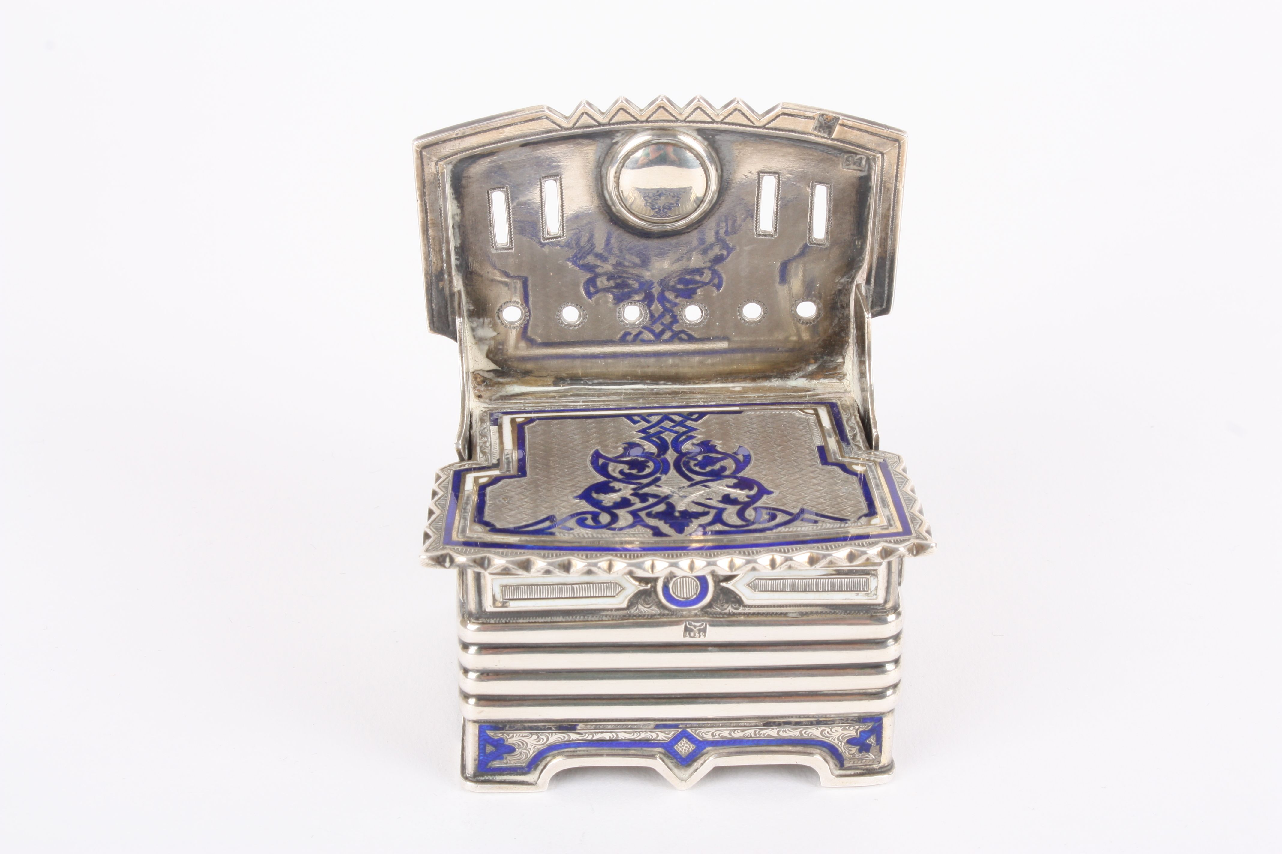 An unusual 19th century Russian silver and enamel novelty vesta in the form of a settle
with