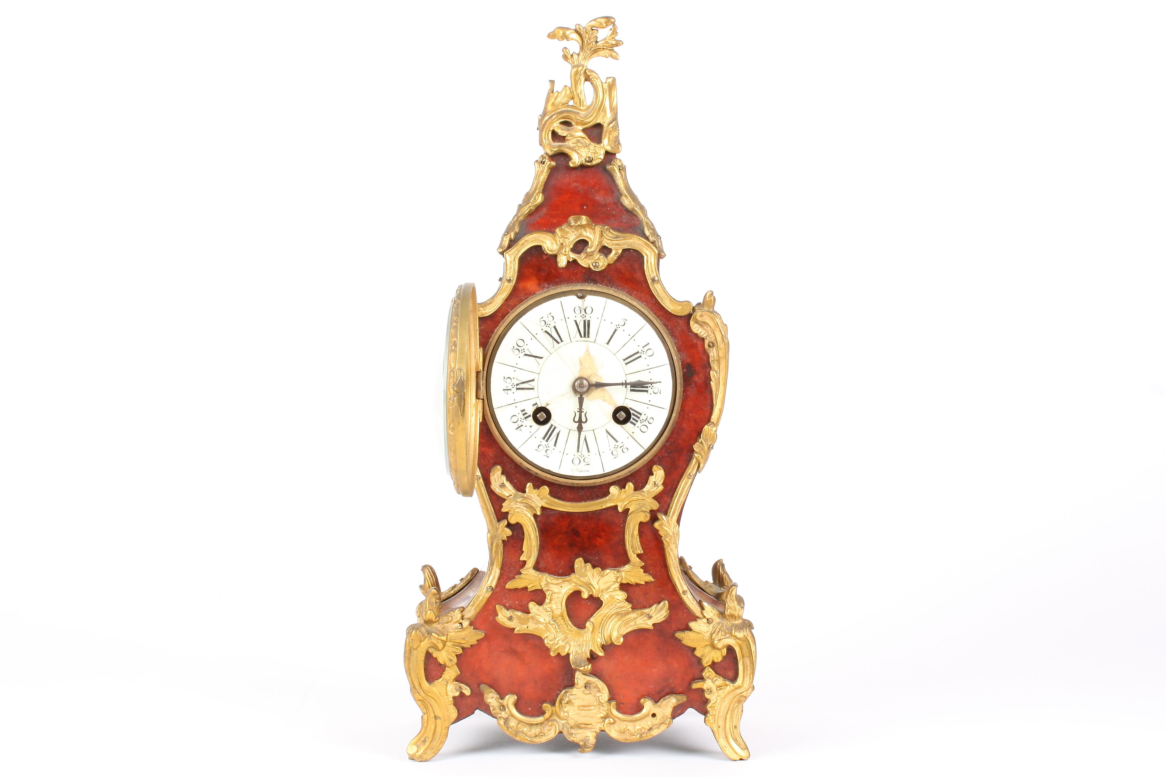 A 19th century French tortoiseshell and ormolu mounted mantel clock
the white enamel dial with black