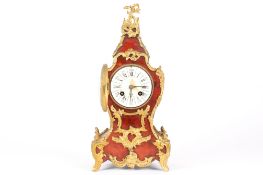 A 19th century French tortoiseshell and ormolu mounted mantel clockthe white enamel dial with black