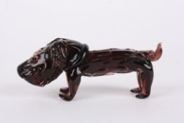 An unusual studio glass model of a doglate 20th century, in pale pink coloured glass., 18 cm long.