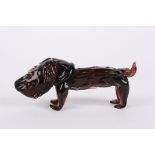 An unusual studio glass model of a dog
late 20th century, in pale pink coloured glass., 18 cm long.