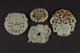 A 20th century Chinese celadon jade carved and pieced floral plaque, another pierced and carved