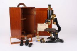 A monocular microscope by Watson & Sonson Y shaped base with adjustable arm, monocular body tube