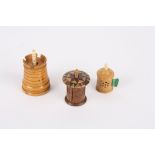 Three treen tape measures 
comprising one Tunbridgeware measure, another in the form of a turret,