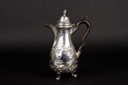 A Victorian silver pear shaped hot water jughallmarked Chester 1898, the body embossed with