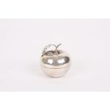 An unusual hammered silver novelty pin box in the form of an apple
possibly South American,