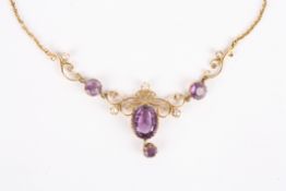 An Art Nouveau gold, amethyst and seed pearl pendant necklacethe large central amethyst with drop