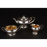 An Edwardian Art Nouveau silver three piece tea set
hallmarked Birmingham 1903, naturalistic form