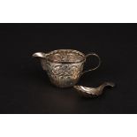 A Victorian repoussé silver jug and a silver caddy spoon
the jug hallmarked Birmingham 1898, the
