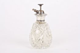 A Sterling silver and glass atomiserthe pear shaped cut glass bottle with Sterling silver top and