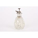 A Sterling silver and glass atomiser
the pear shaped cut glass bottle with Sterling silver top and