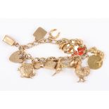 A 9ct gold charm bracelet with 17 charms
including a kangaroo, a cockerel and a ships lamp, with a