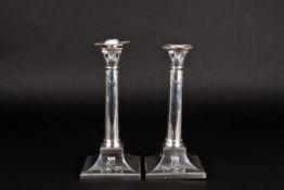 A pair of George V silver Corinthian column candlestickshallmarked London 1915, with embossed