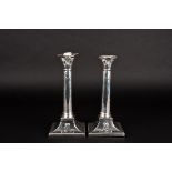 A pair of George V silver Corinthian column candlesticks
hallmarked London 1915, with embossed