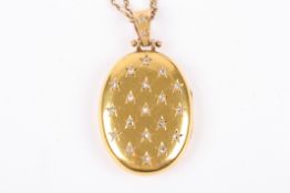 A Victorian diamond set oval gold locket on chainthe locket with Continental marks and set with