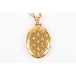 A Victorian diamond set oval gold locket on chain
the locket with Continental marks and set with