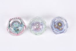 Three Whitefriars facetted millefiori glass paperweightsone featuring a tropical fish dated 1976,