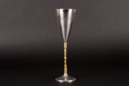 A Stuart Devlin silver and silver gilt champagne flutehallmarked London 1977, the conical bowl with