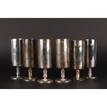 A matched set of six Irish silver champagne flutes
hallmarked Dublin 1971, of cylindrical form, with