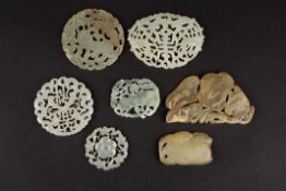 A small collection of Chinese 20th century carved hardstone plaquescomprising three circular